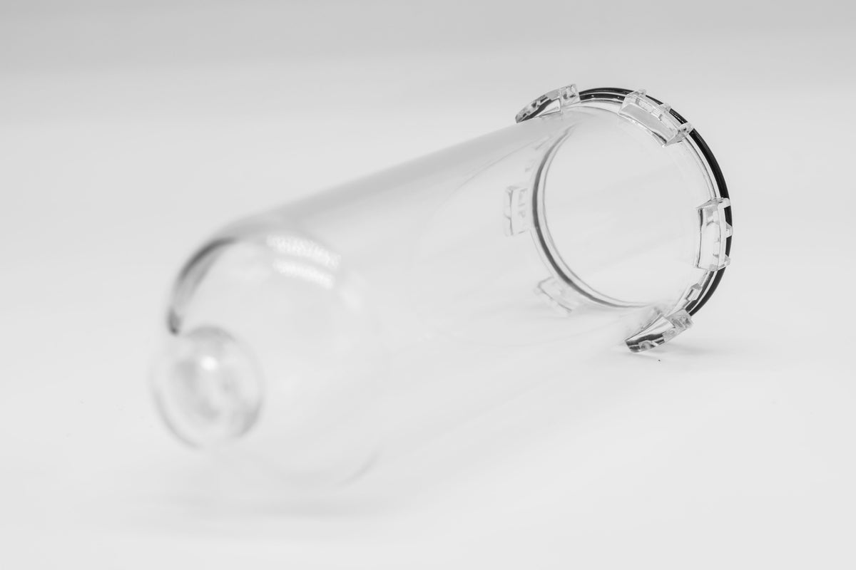 FLI coated transparent oil tank on a white background.