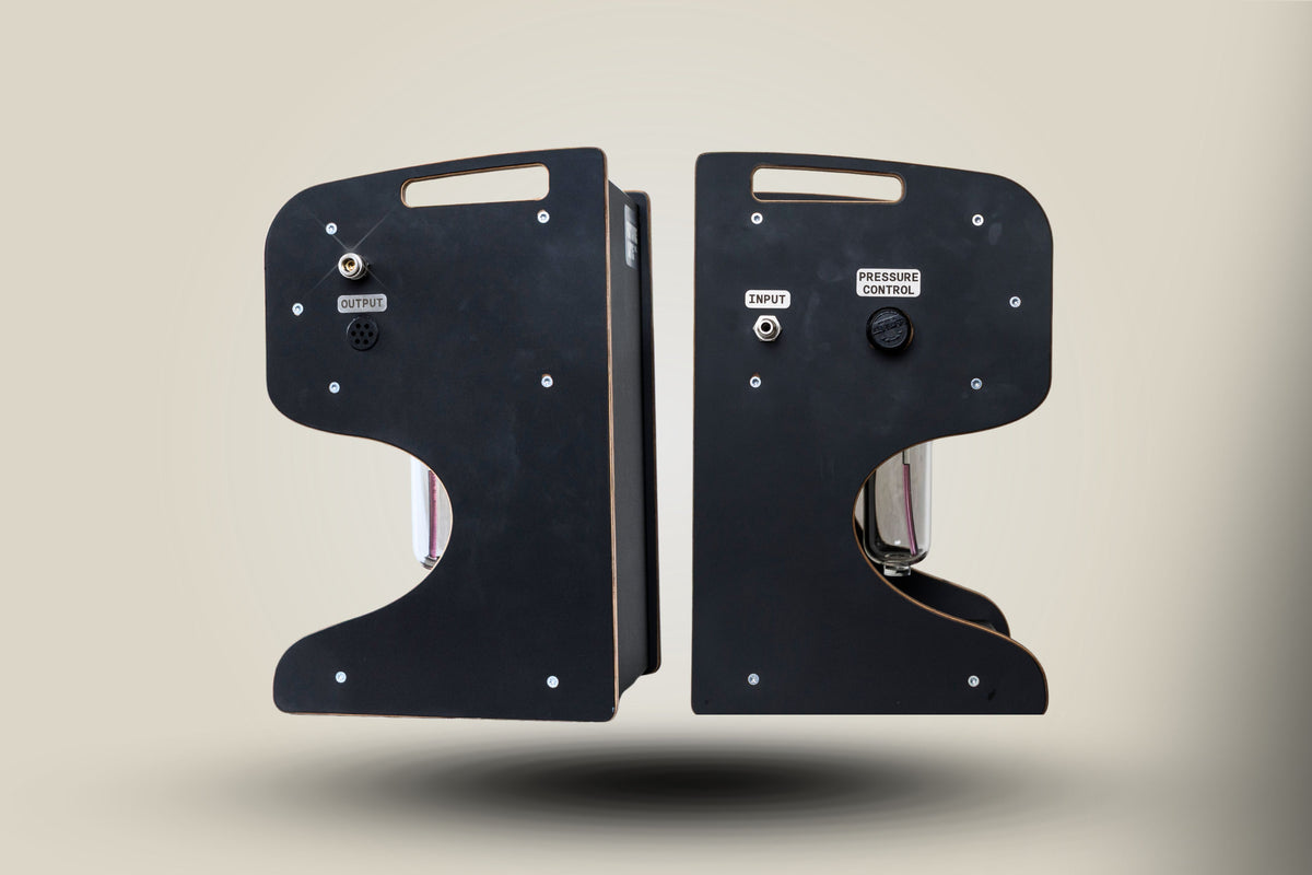 Two FLI VENTURI vacuum bleeders floating against a beige background, showing both side views of the device.