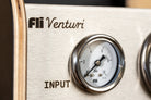 Close-up of a brushed metal Fli Venturi INPUT valve component with a round analog gauge and black branding.