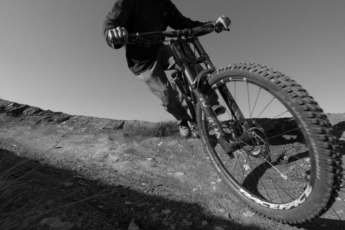 Front wheel of a Moutnainbiker shredding a trail showing a Fox Fork. Photo: Daniel Niederkofler