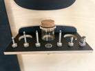 full set of MTB shok adapters in a n elegant hanging wall mount made of black wood