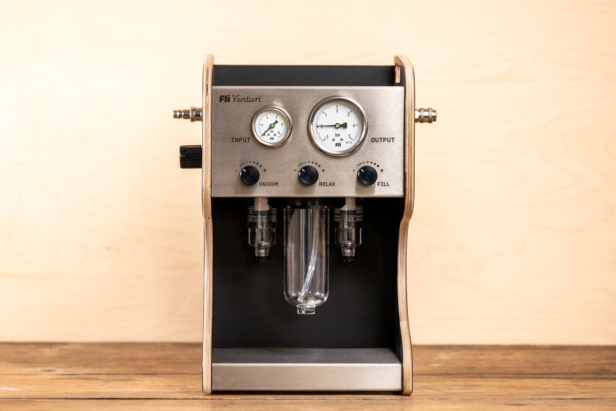 Front view of the FLI VENTURI suspension bleeder that looks like an espresso machine.