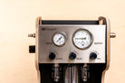 Front detail view of the FLI VENTURI vacuum bleeder, showing aluminum knobs for operating two pressure gauges.